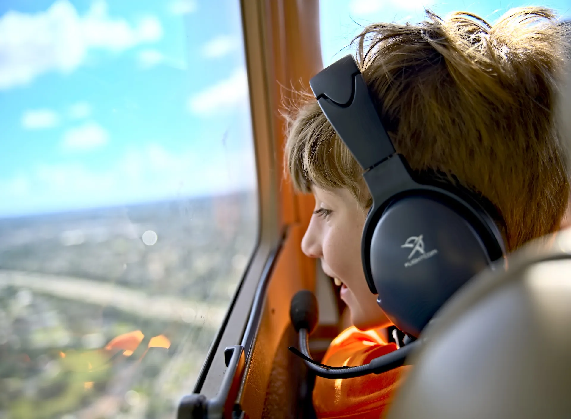 sun city aviation academy young program student smiling in a cessna cockpit