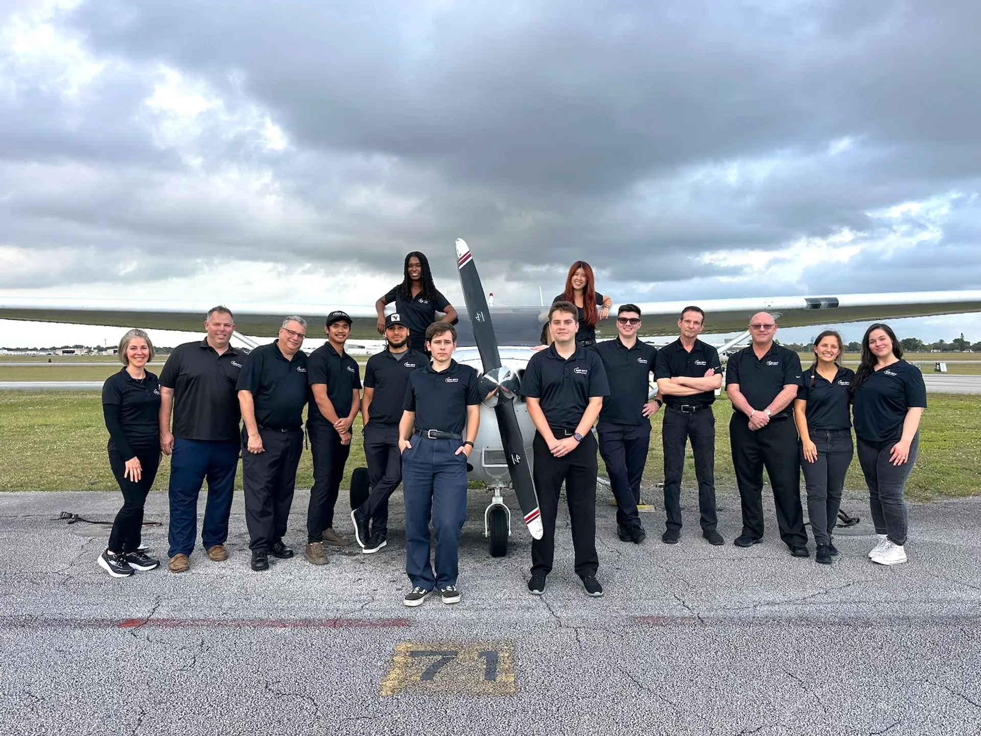 sun city aviation academy team of pilots and instructors at the airport