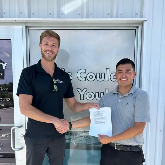 Sun City Aviation Academy instructor shaking hands with a student