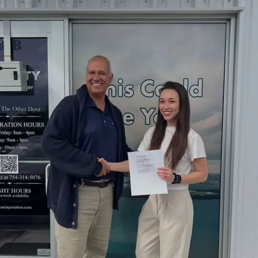 Sun City Aviation Academy instructor shaking hands with a female student