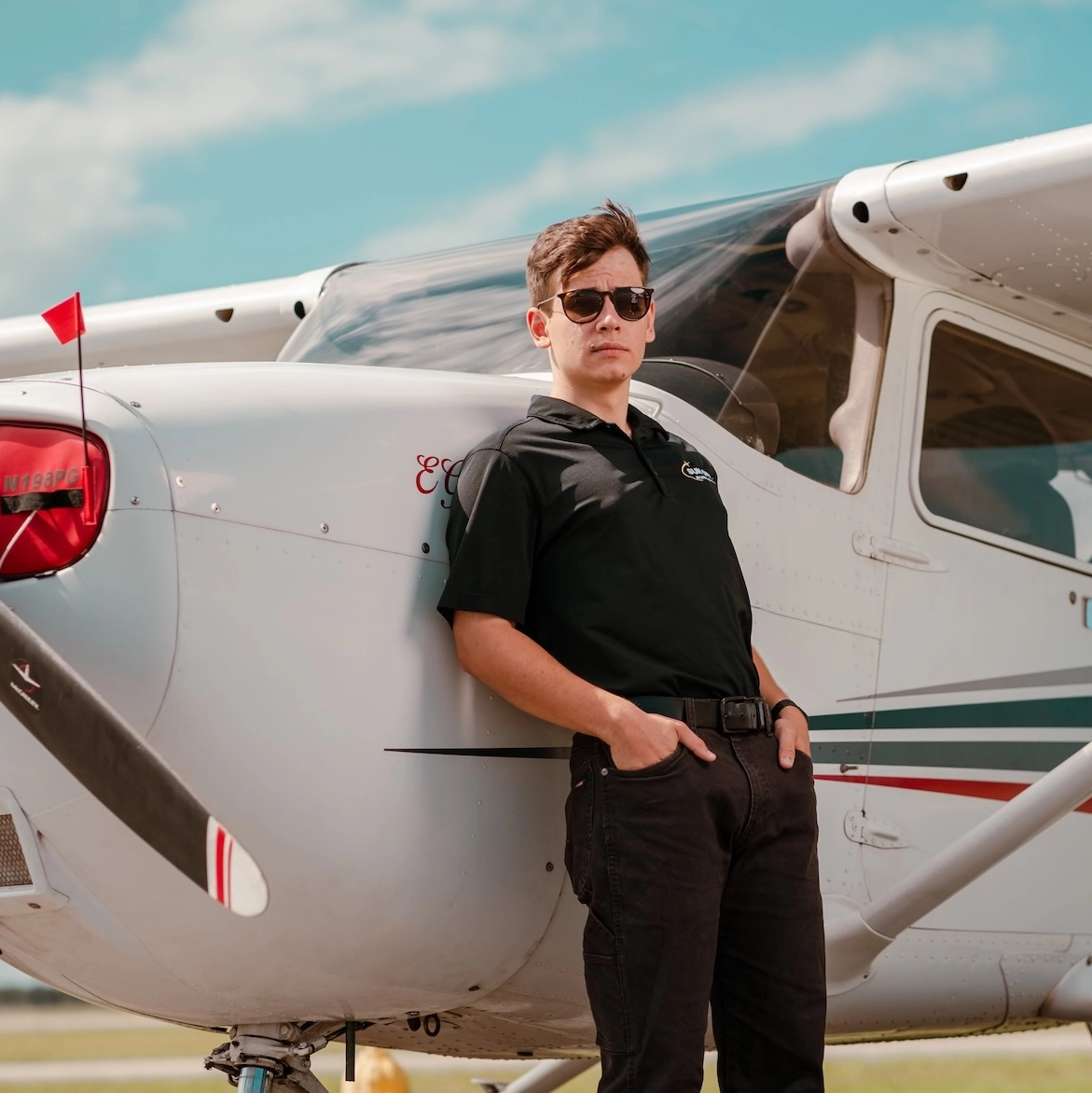 sun city aviation academy student flying a plane over the city of miami