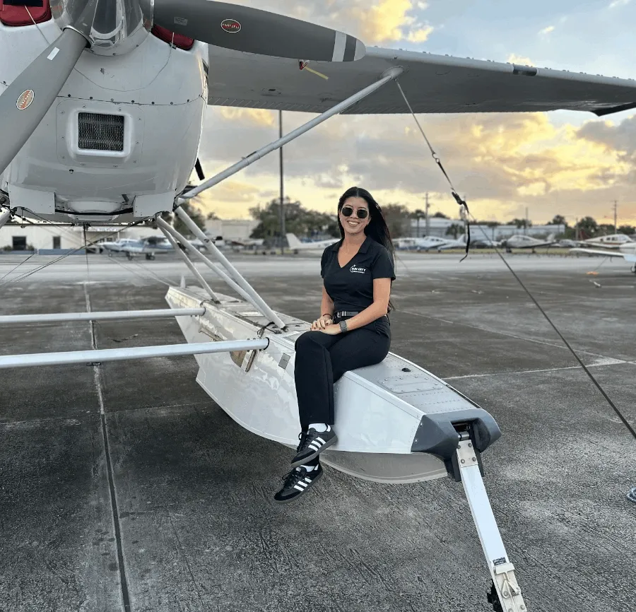 Student pilot inspecting aircraft before flight