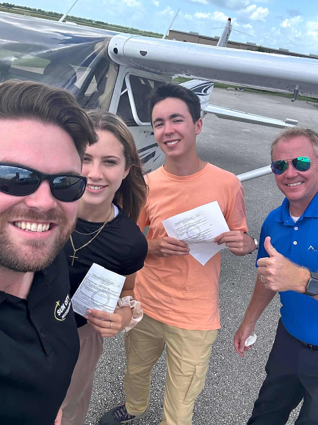 sun city aviation academy student flying a plane over the city of miami