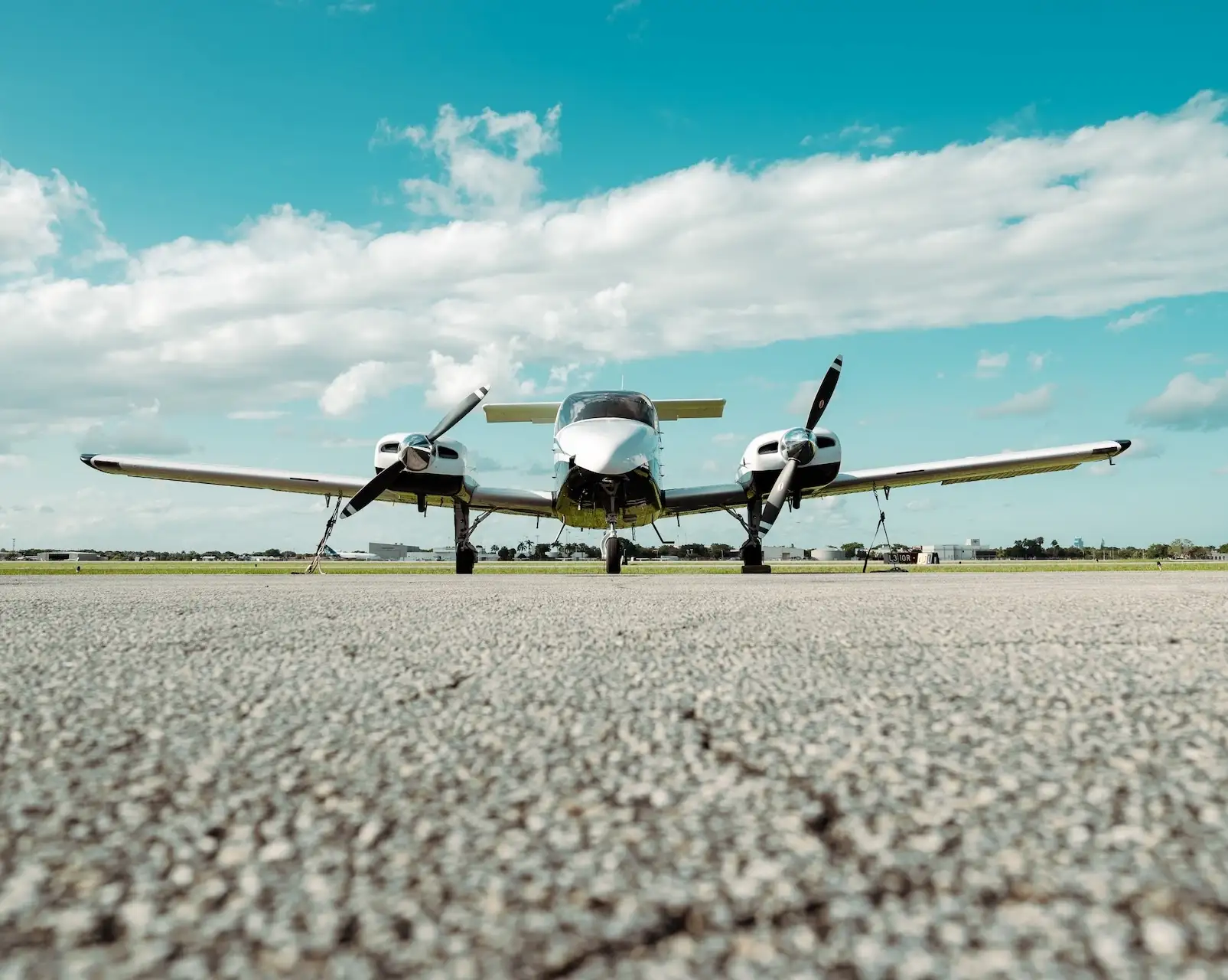 sun city aviation student and flight instructor in front of a multi-engine airplane