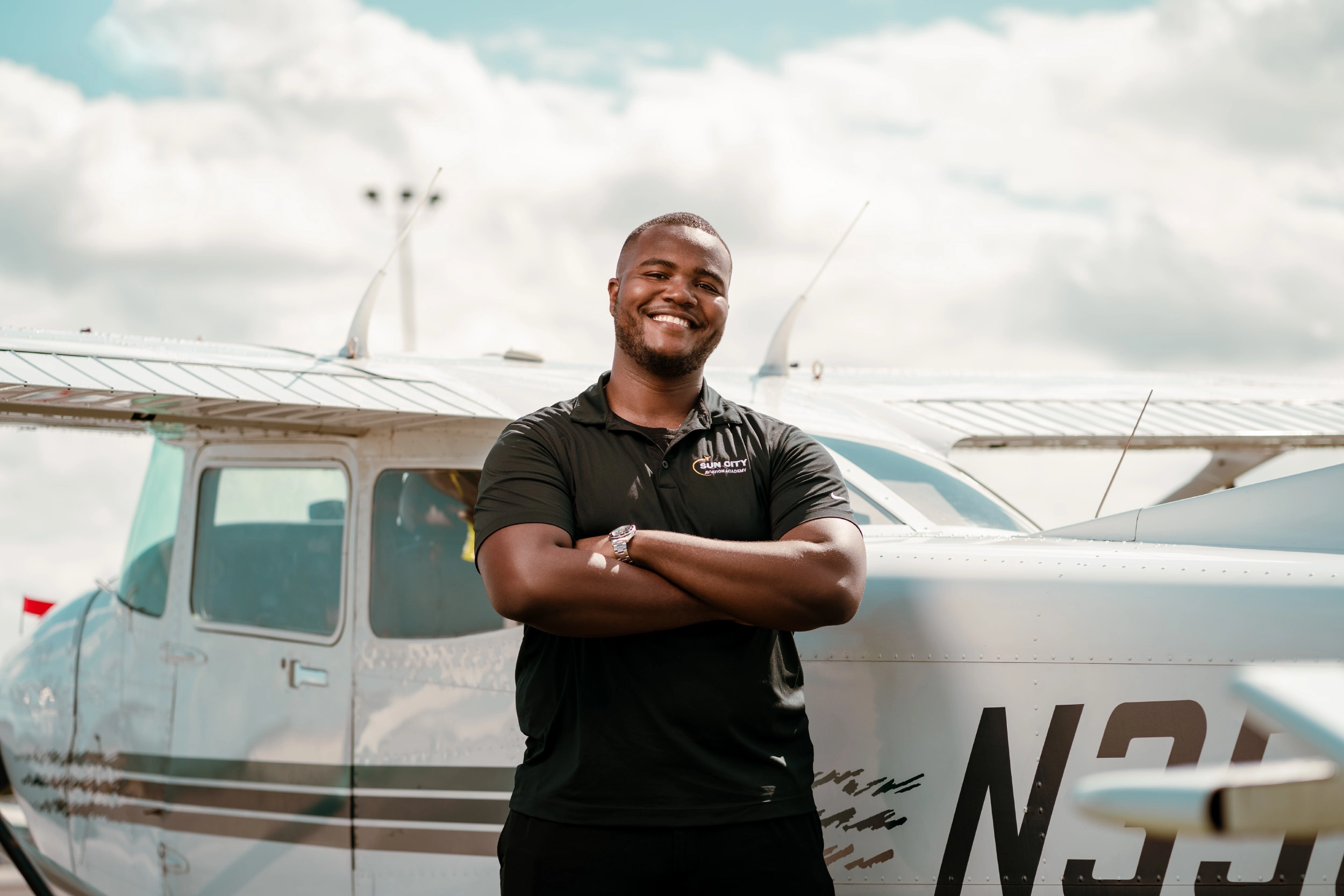 Sun City Aviation Academy cool pilot in front of a plane at the airport