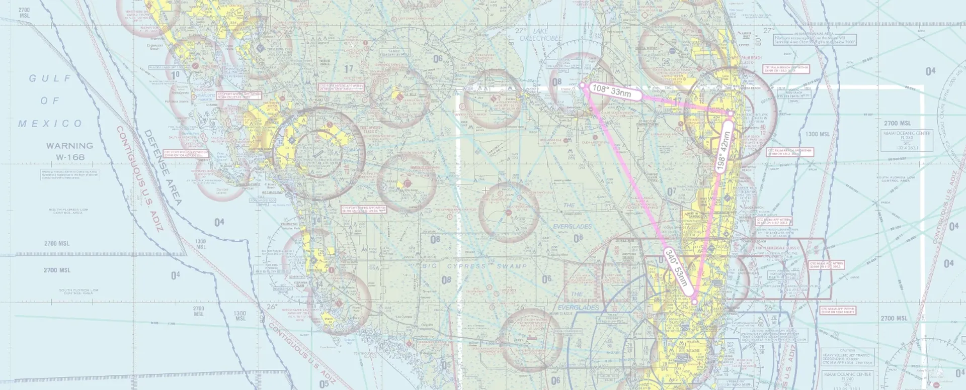 sun city aviation academy vfr chart with a pilot's headset and sunglasses