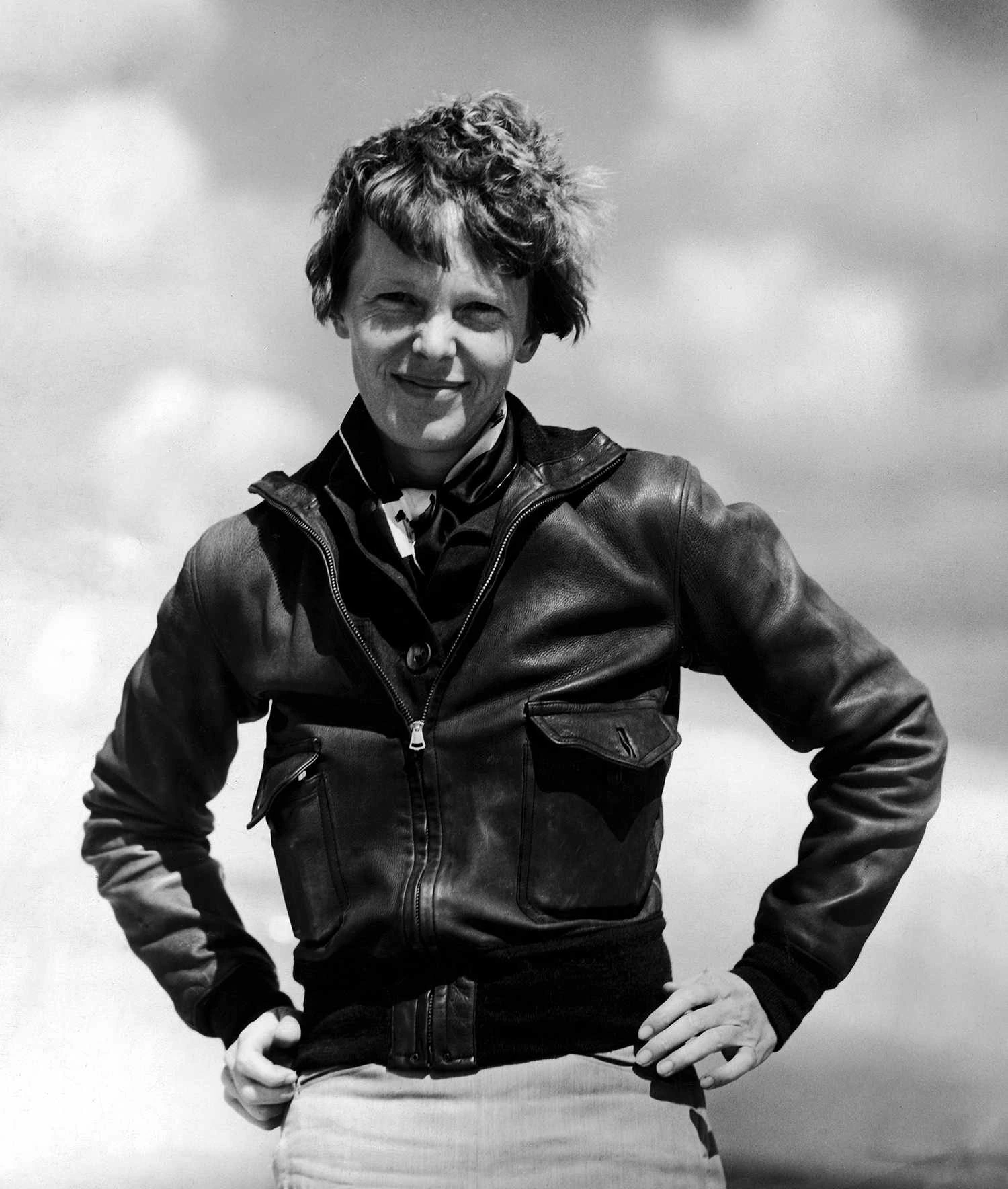 Amelia Earhart, a trailblazer in women's flight training, posing for a photo in her gear