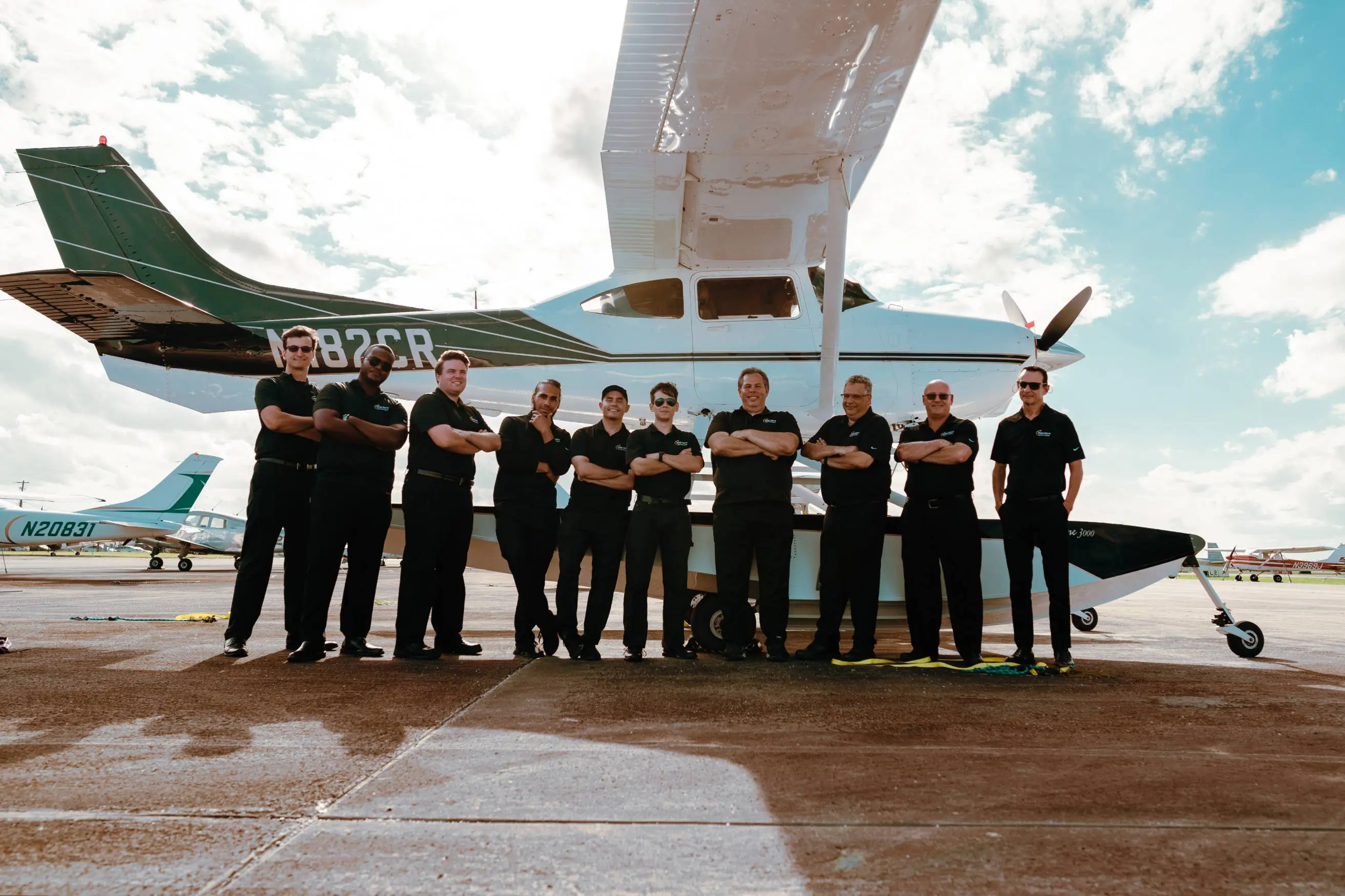 Sun City Aviation team in front of a seaplane